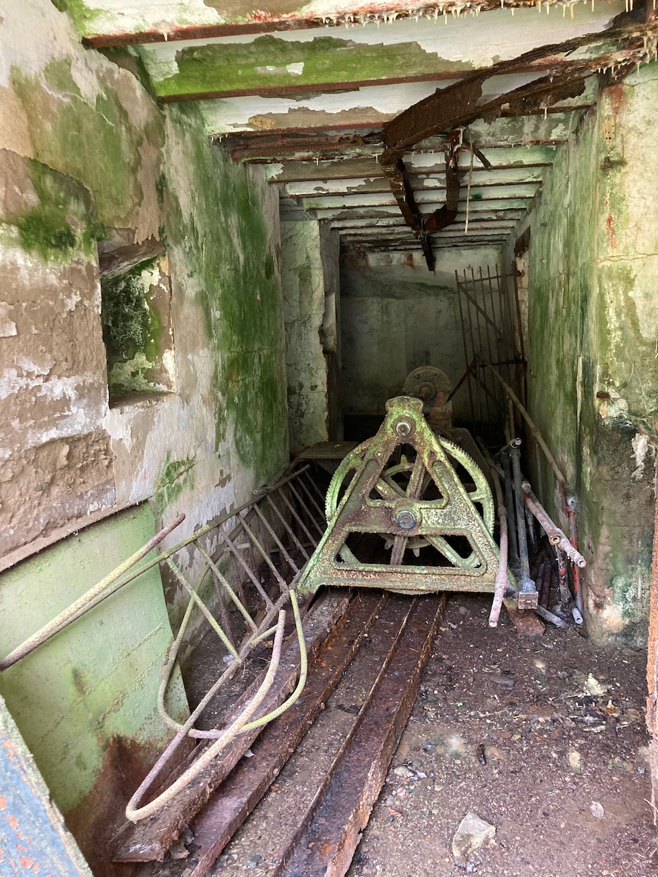 Hallway filled with debris under tower.