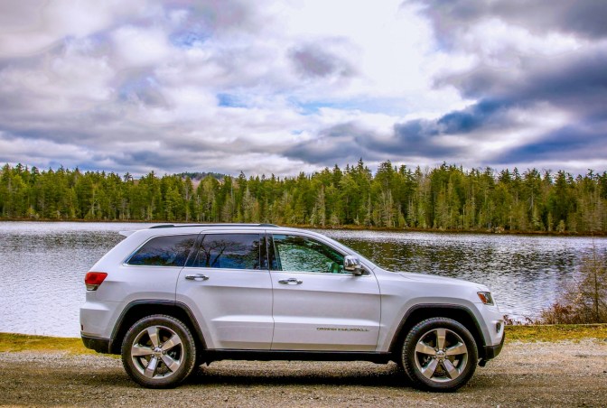 White Jeep Grand Cherokee parked in front of Quiver Pond.