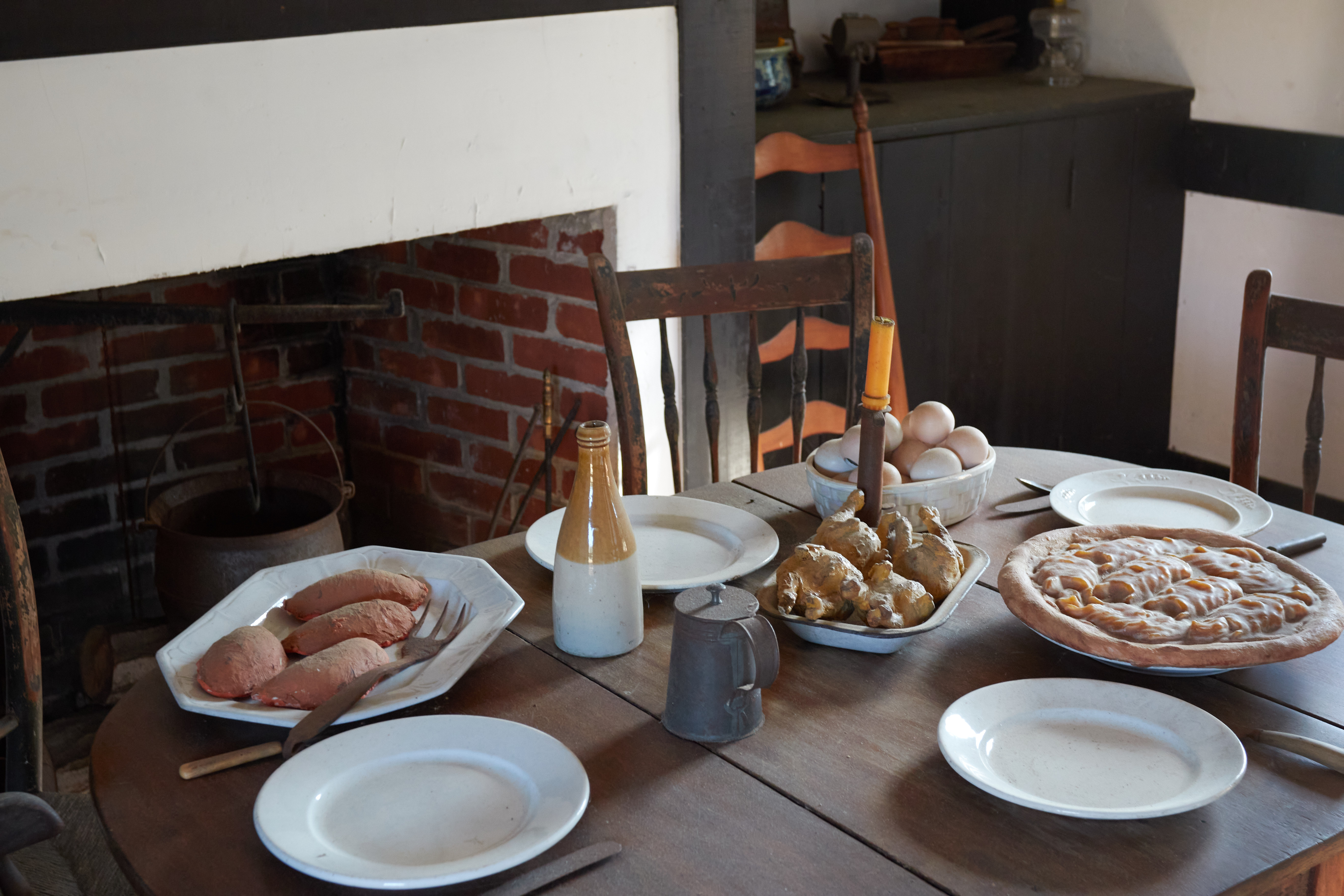 Kitchen table in cottage with food.