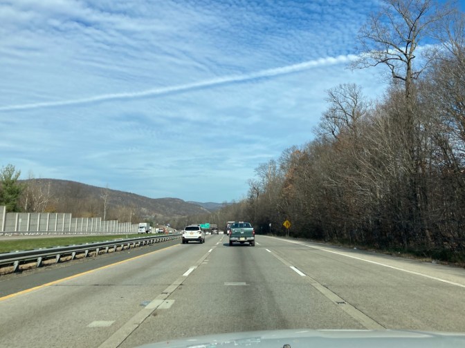 View of New York Thruway on sunny day with some clouds.