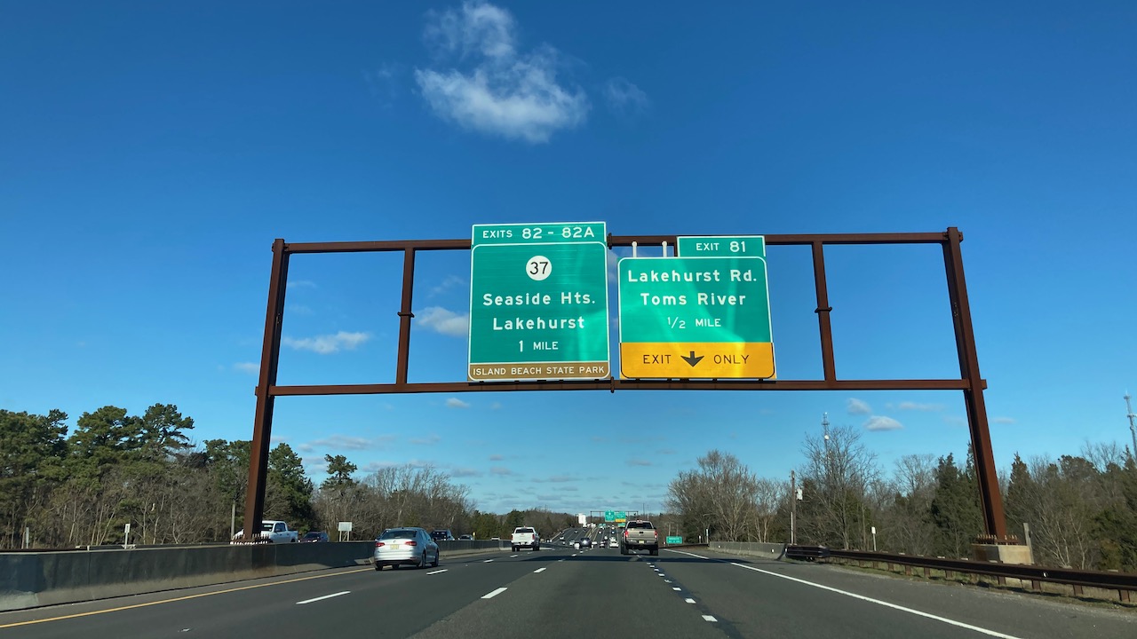 Signs over Garden State Parkway for Seaside Heights exit and Lakehurst Road exit.
