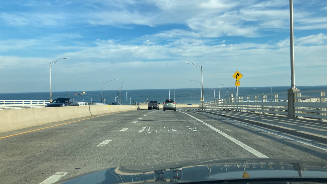 View of Atlantic Ocean from atop highway ramp.