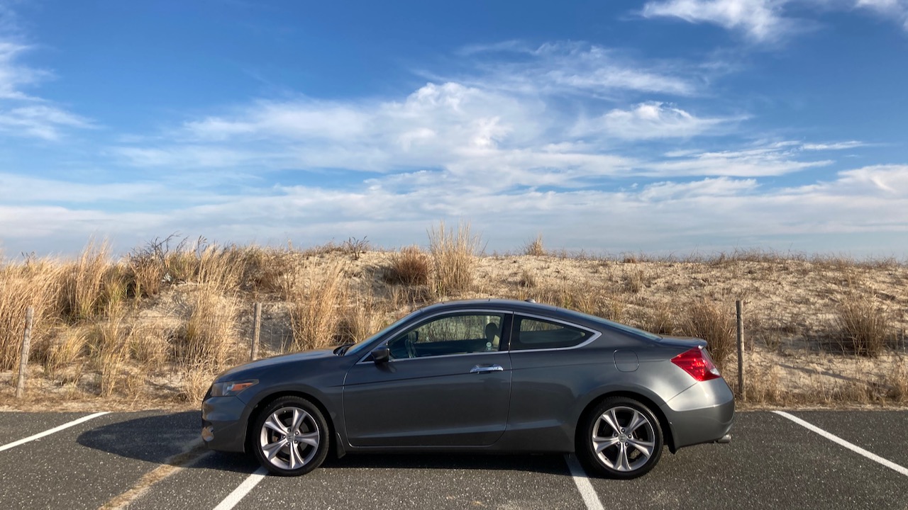 2012 Honda Accord parked beside dune.