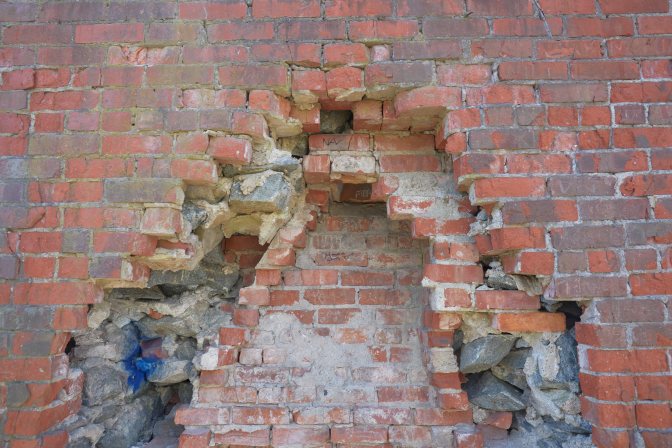 View of remains of brick fireplace.
