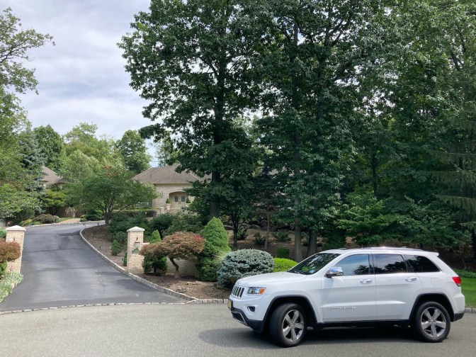 White Jeep Grand Cherokee parked in front of home from The Sopranos