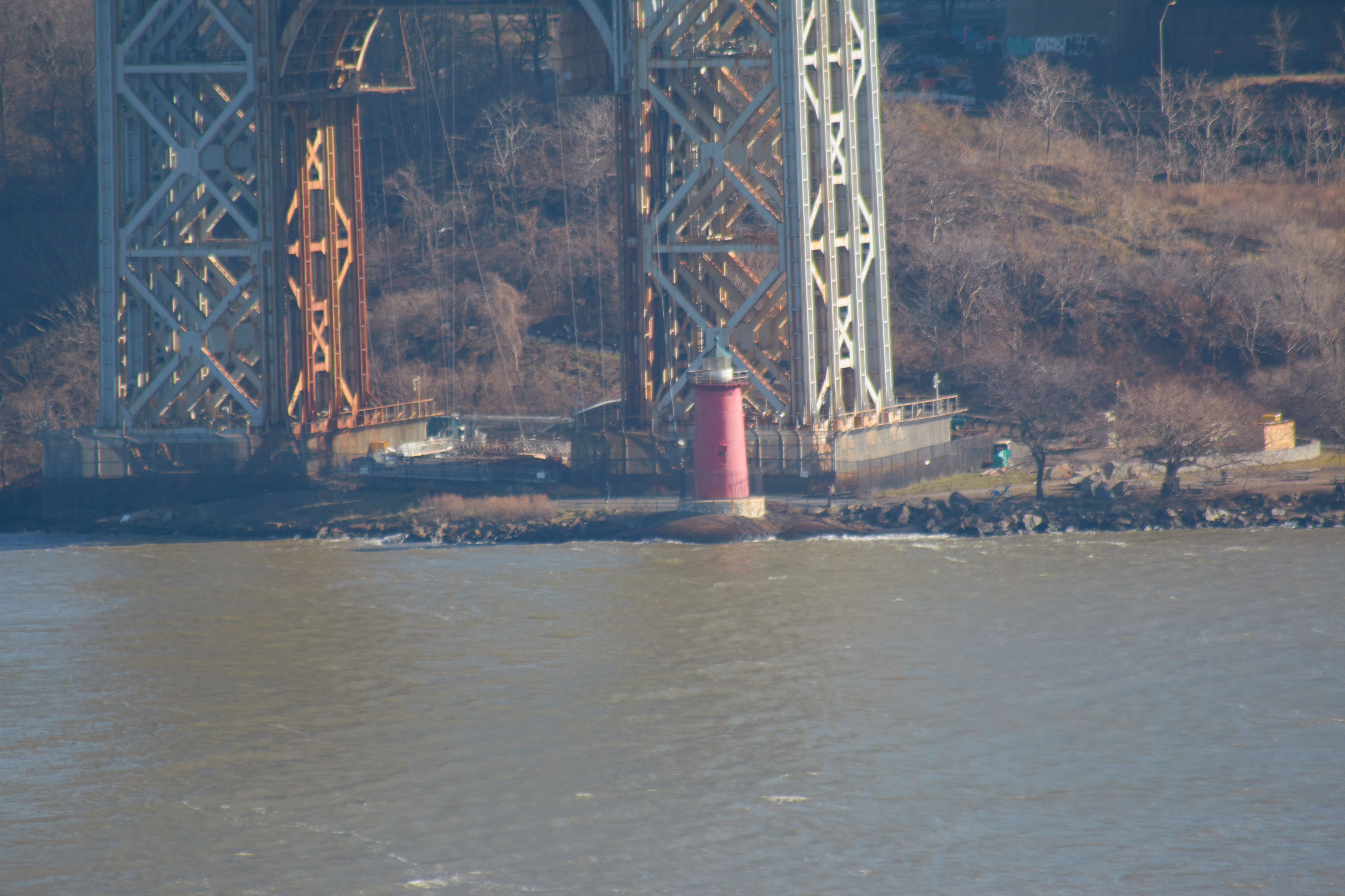 View of Jeffrey Hook Lighthouse at base of bridge.