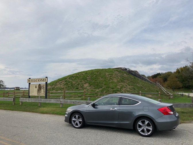 2012 Honda Accord coupe parked in front of earthwork defensive fortification.