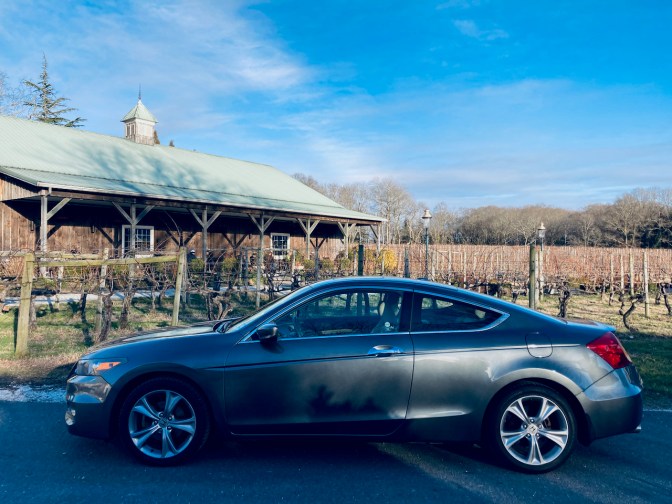 2012 Honda Accord coupe parked in front of vineyard.
