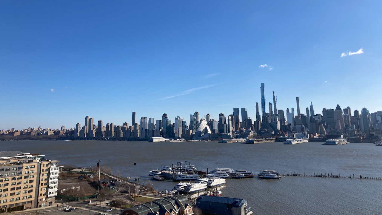 View of Manhattan skyline from banks of Hudson River in Weehawken.