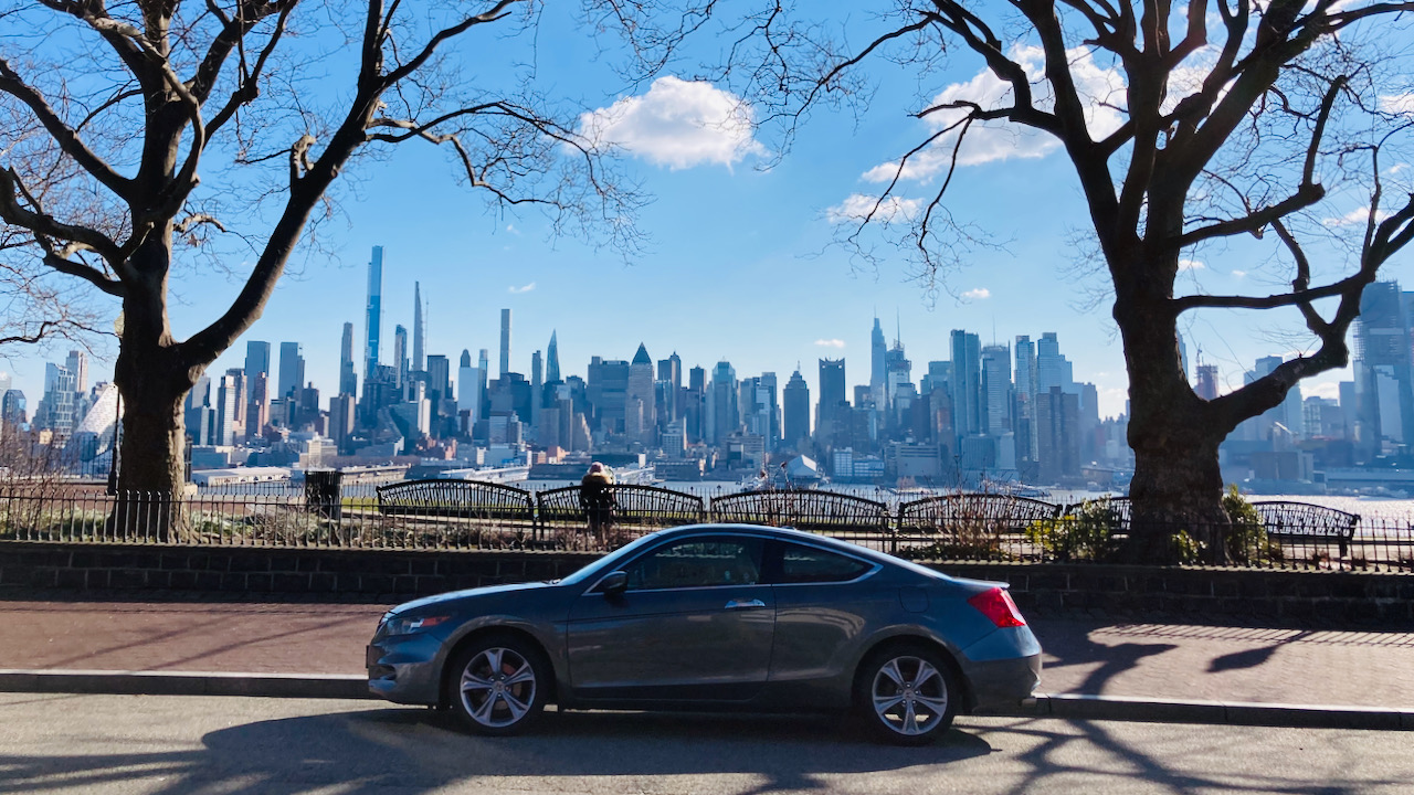 2012 Honda Accord parked in front of esplanade. The Manhattan skyline is in the background.