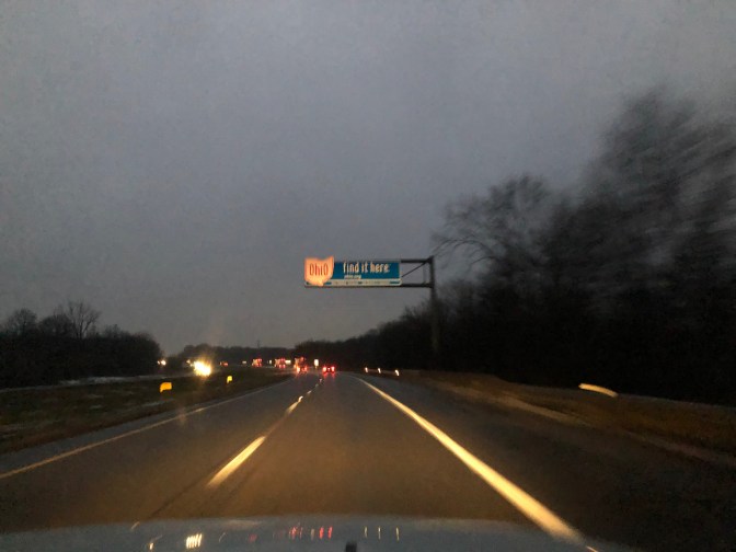Sign over highway that says OHIO - FIND IT HERE.