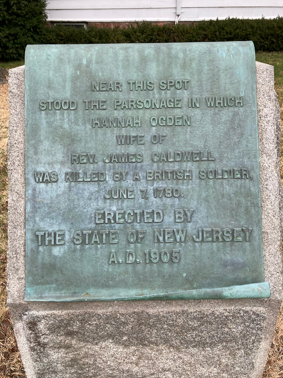 Plaque that said NEAR THIS SPOT STOOD THE PARSONAGE IN WHICH HANNAH OGDEN WIFE OF REV. JAMES CALDWELL WAS KILLED BY A BRITISH SOLDIER JUNE 7 1780. ERECTED BY STATE OF NEW JERSEY AD 1905.