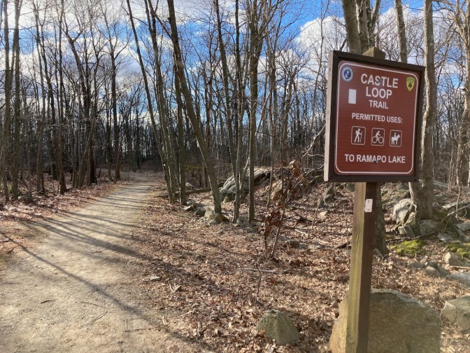 Sign along Forest path that says CASTLE LOOP TRIAL TO RAMAPO LAKE