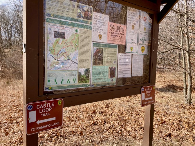 Information board on trail, with map of park.