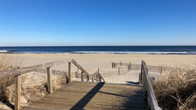 Wooden stairs leading to beach.