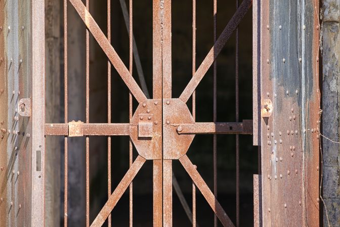 Barred metal doors.