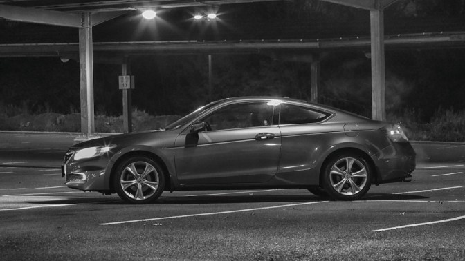 2012 Honda Accord coupe at night in black and white.
