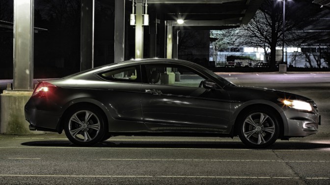 2012 Honda Accord coupe at night in parking lot.