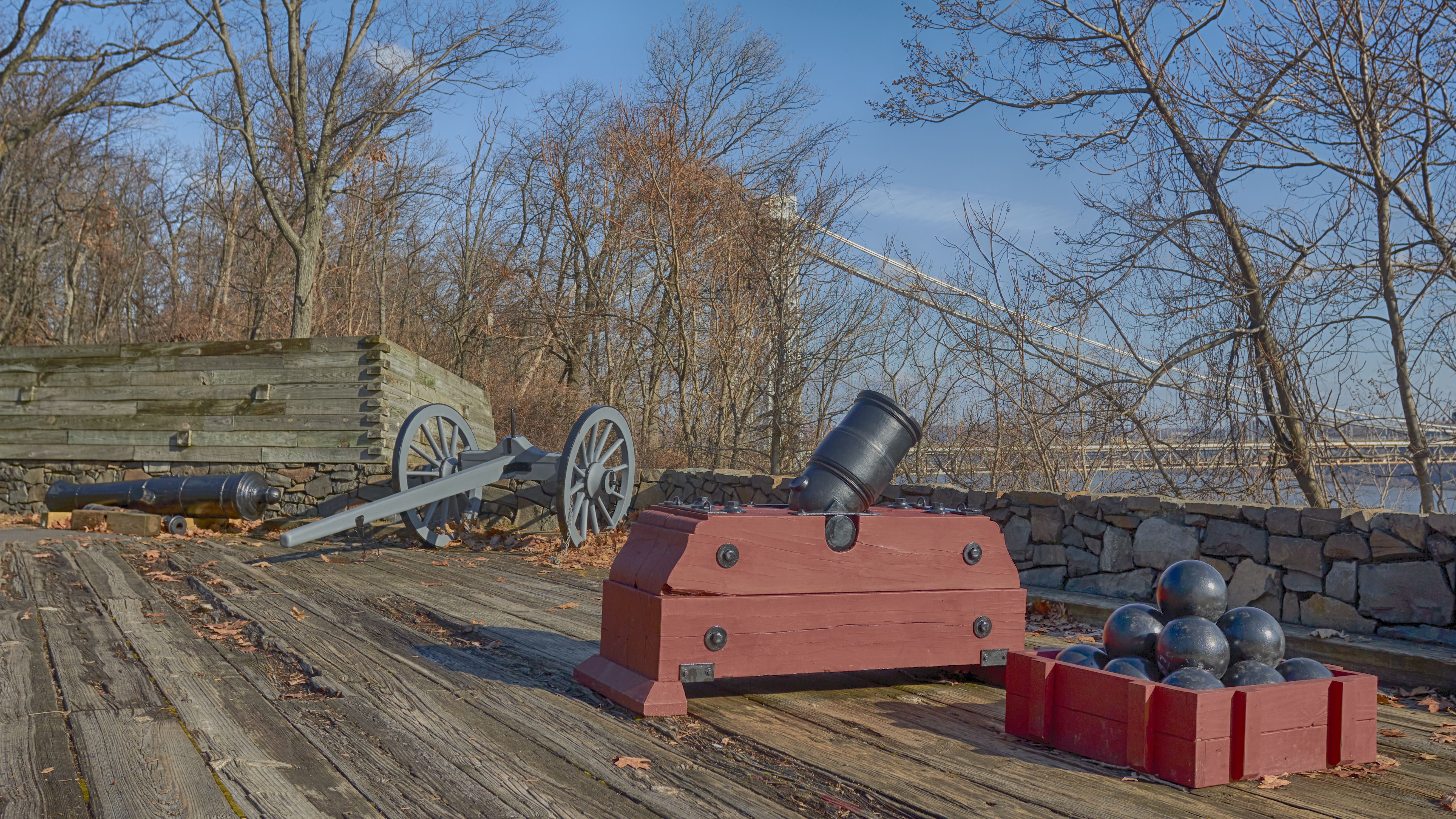 Gunnery emplacement in Fort Lee, including a mortar with cannon balls, and a cannon.