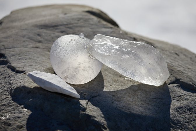 Crystals arranged on large stone.