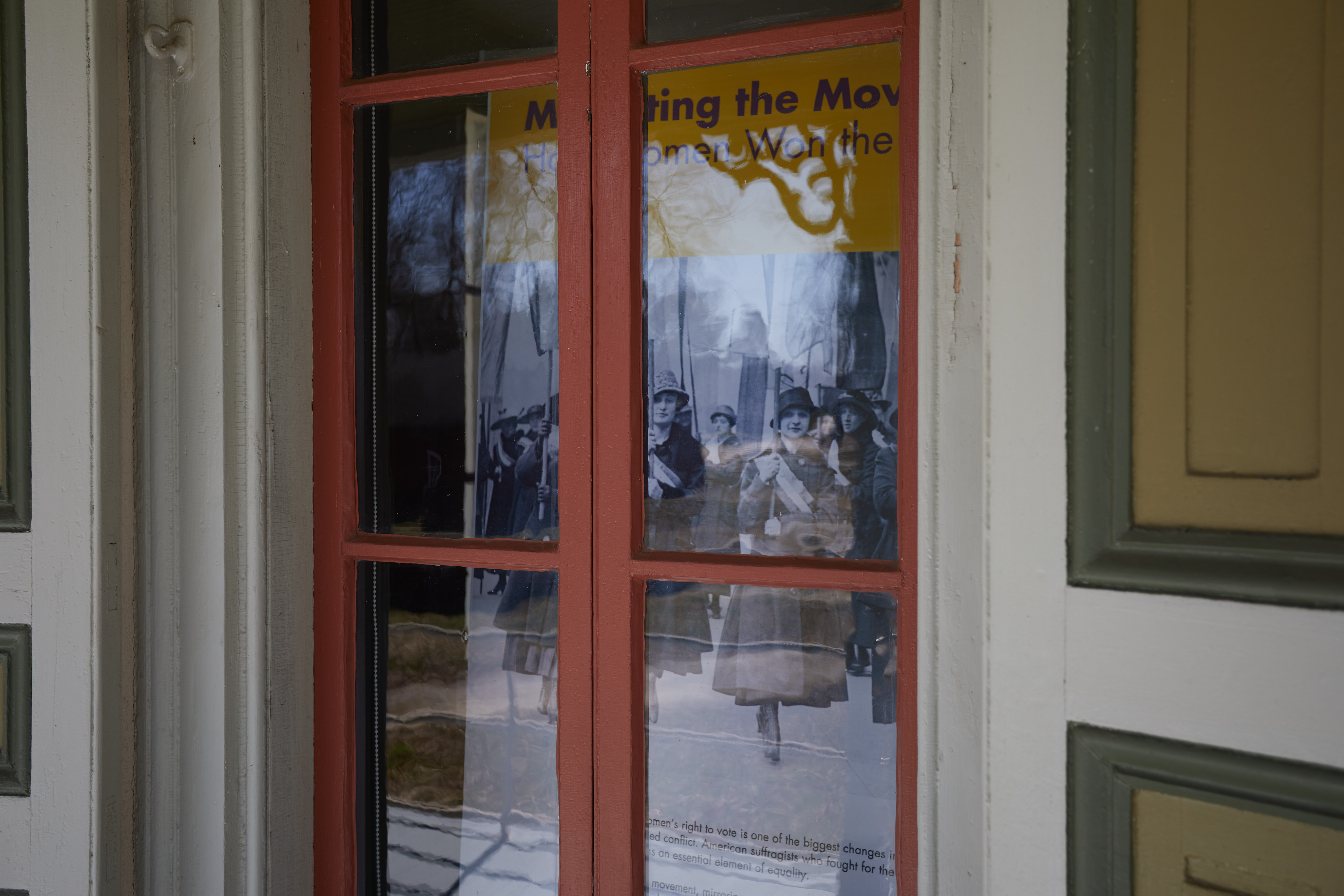Display on women's suffrage, viewed through the window of Paulsdale.