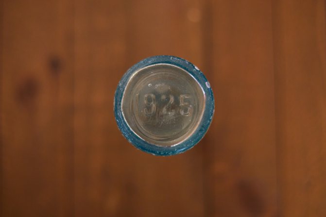 Bottom of glass bottle that reads 1925.