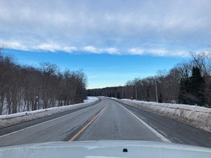 Tree and snow-lined Route 28 in New York.