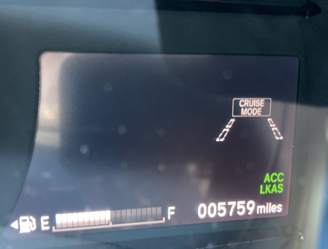 Screen with fuel gauge, cruise control indicator, odometer, and other safety systems.
