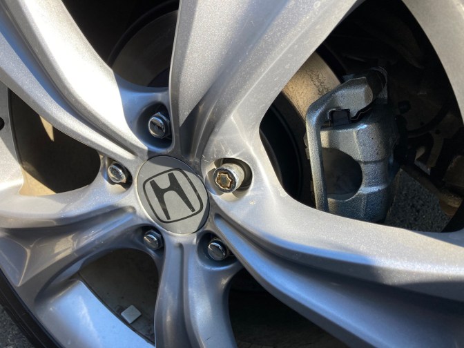 Wheel, with focus on new caliper and disc rotor.