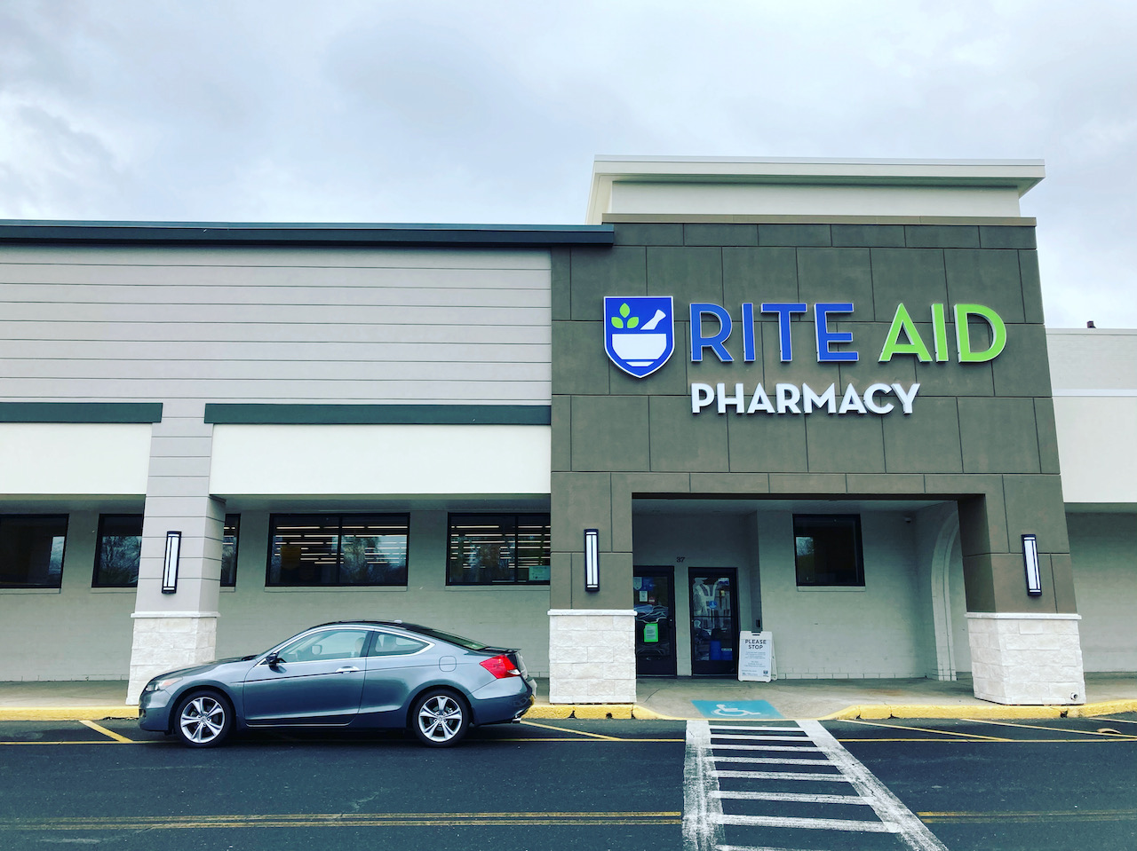 2012 Honda Accord parked in front of Rite Aid Pharmacy.