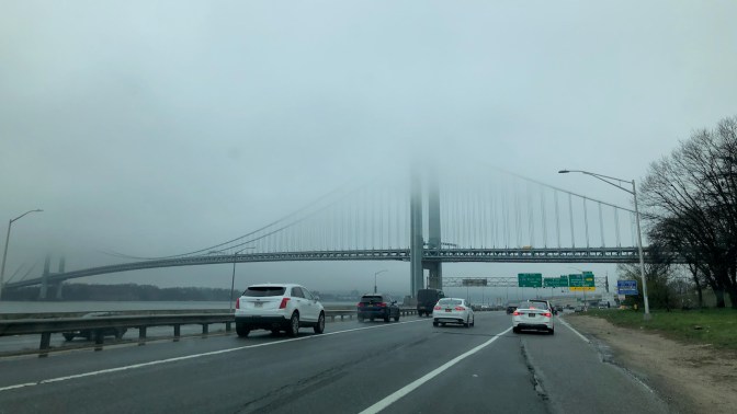 Verrazano-Narrows Bridge, with top of bridge covered in fog.
