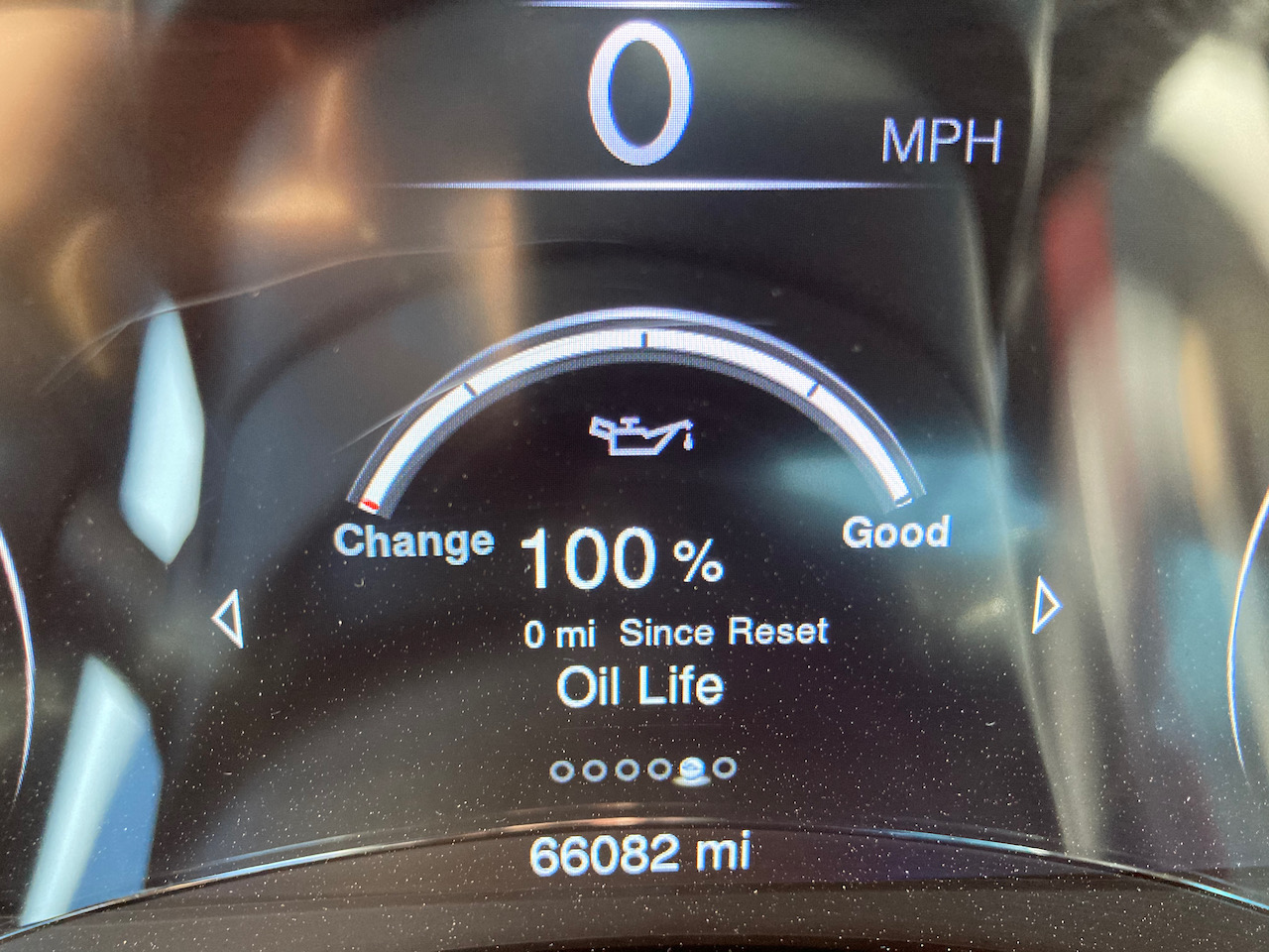 Car maintenance minder showing 100% oil life