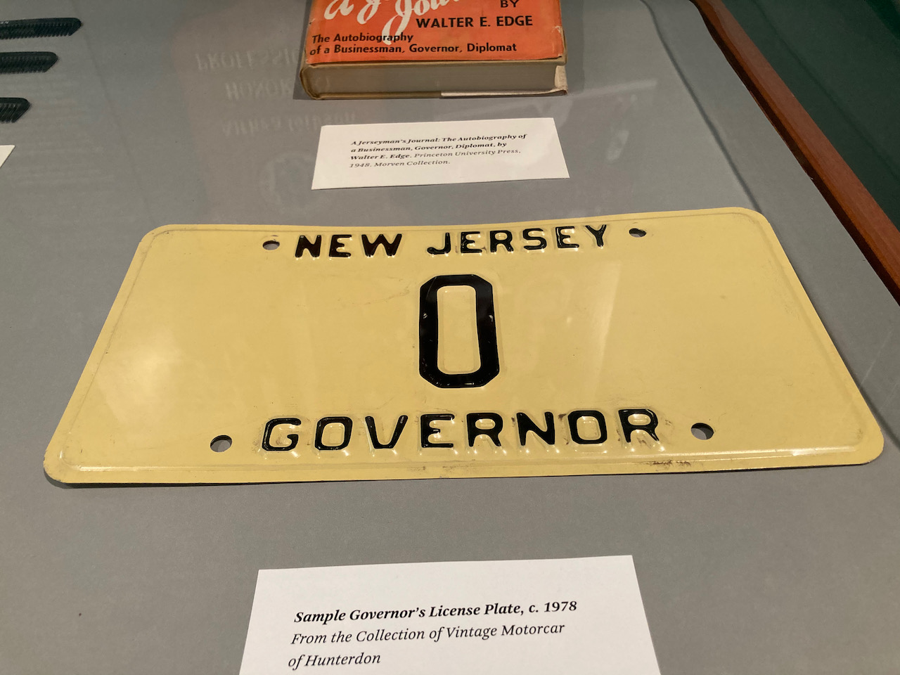 Display case with license play that reads NEW JERSEY 0 GOVERNOR.