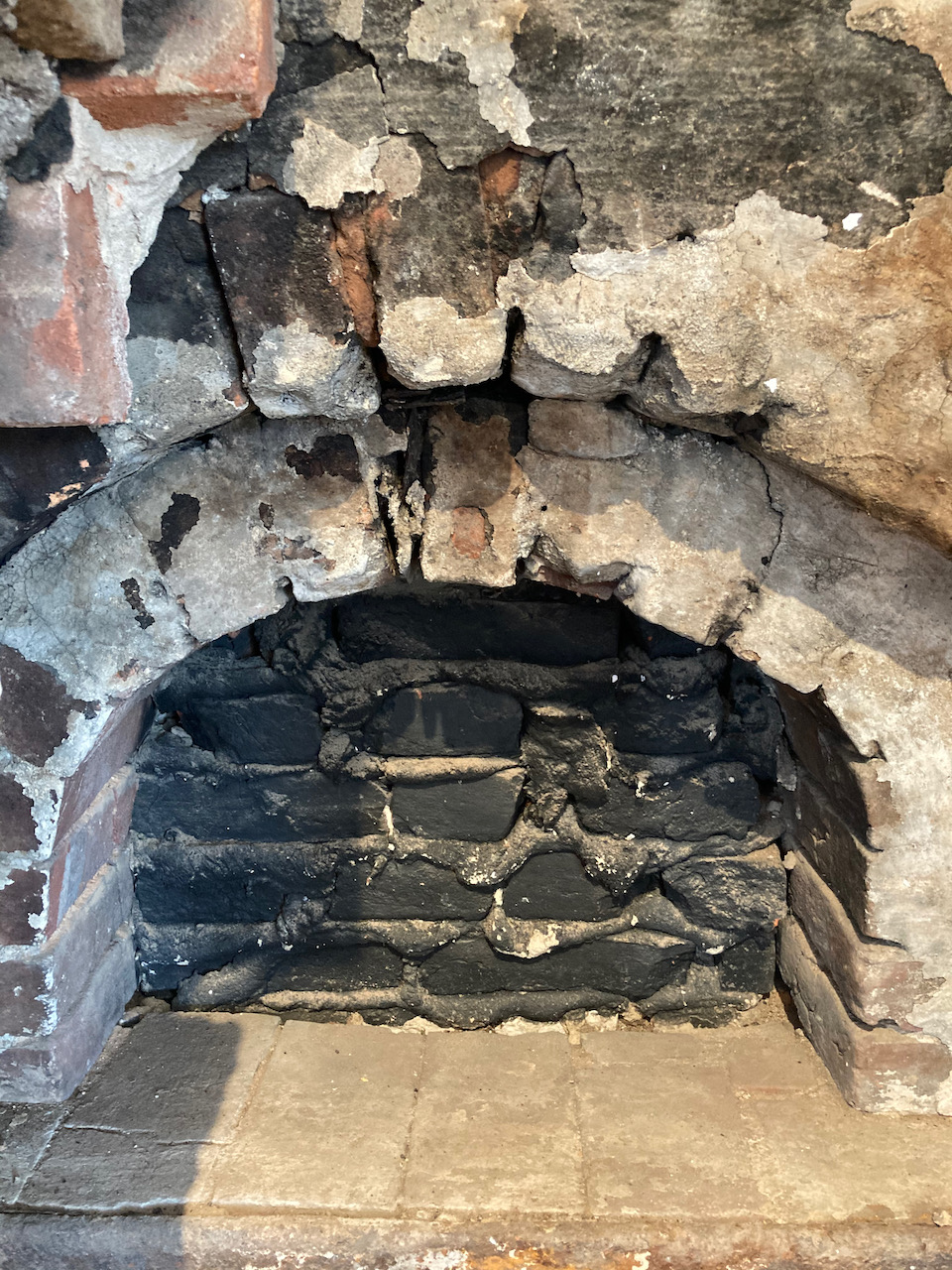 Exposed brick hearth.