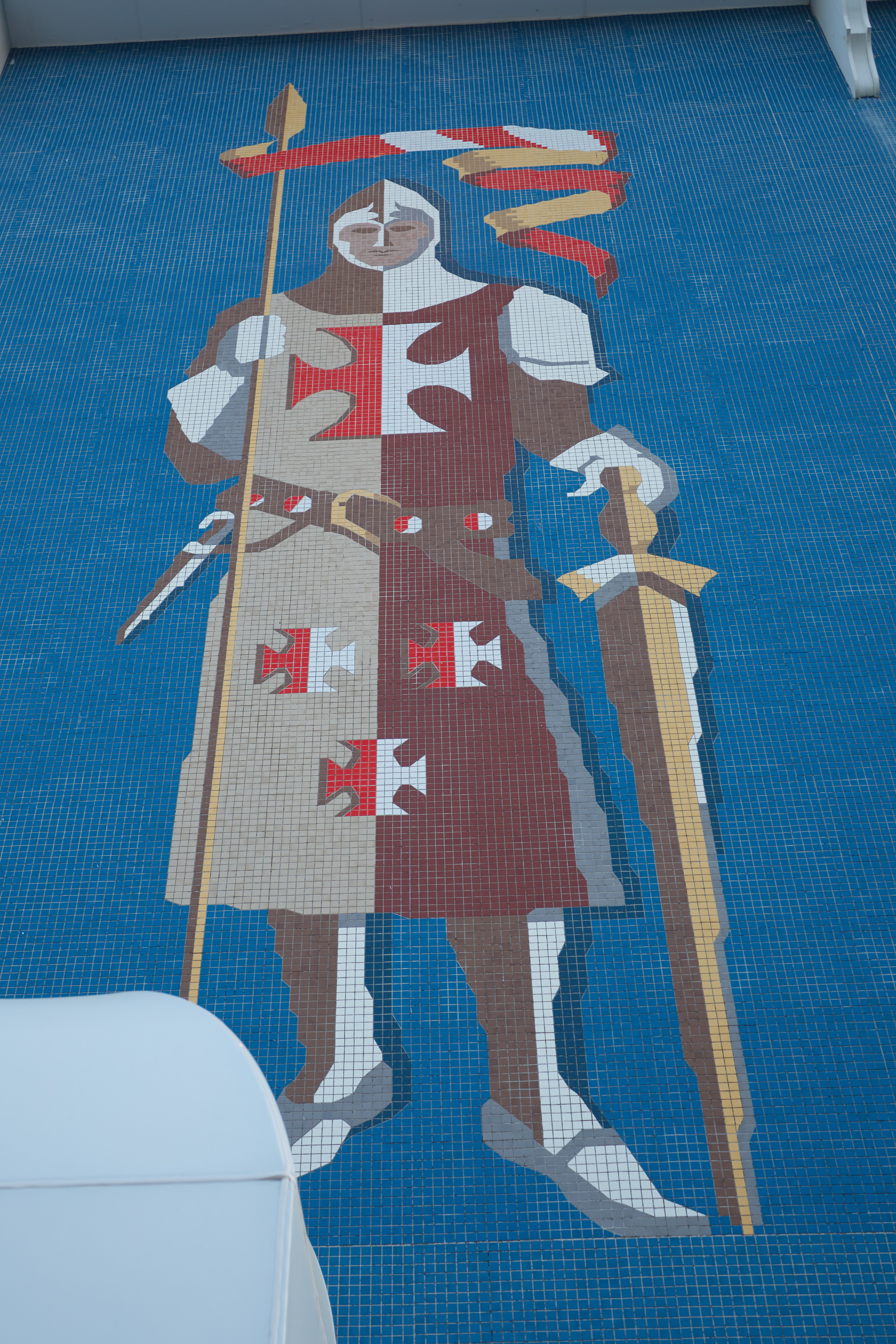 Tile Crusader knight on side of building.