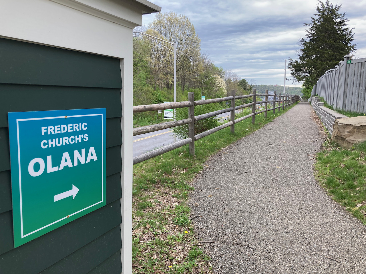 Paved path, with sign near it that says FREDERIC CHURCH'S OLANA.