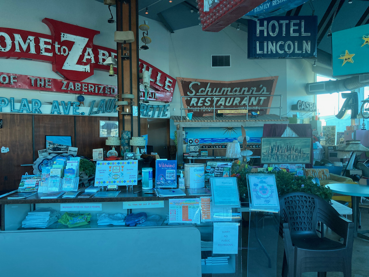 Interior of Doo Wop museum, with neon signs and items in display cases.