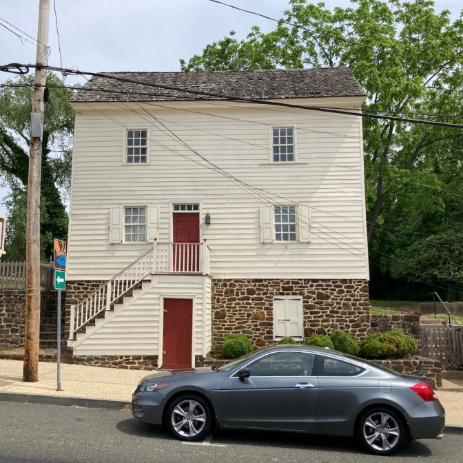 2012 Honda Accord coupe, parked in front of two-story white building.