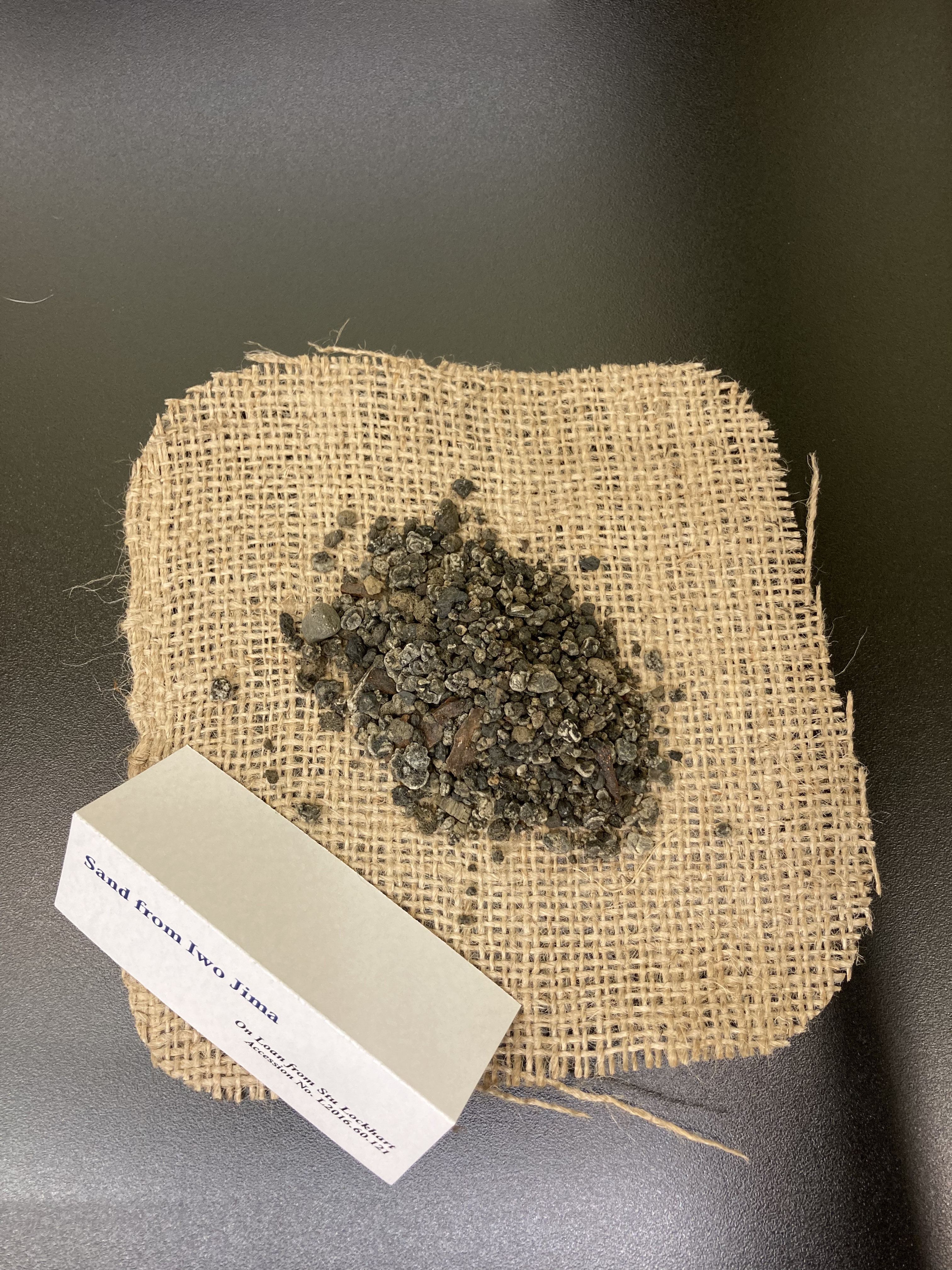 Sand from Iwo Jima, on cloth napkin.