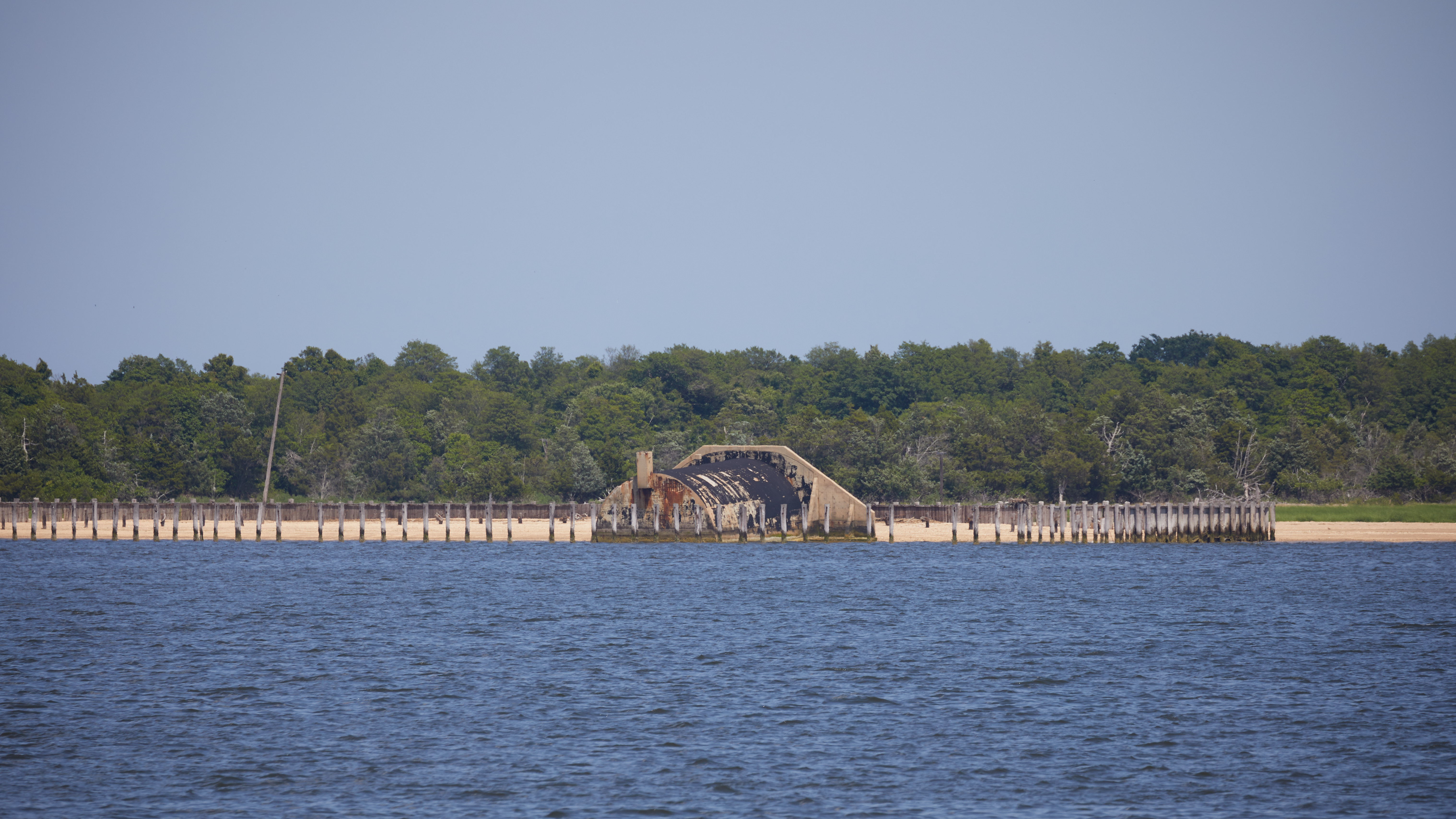 View of concrete bunker along shore of Sandy Hook.