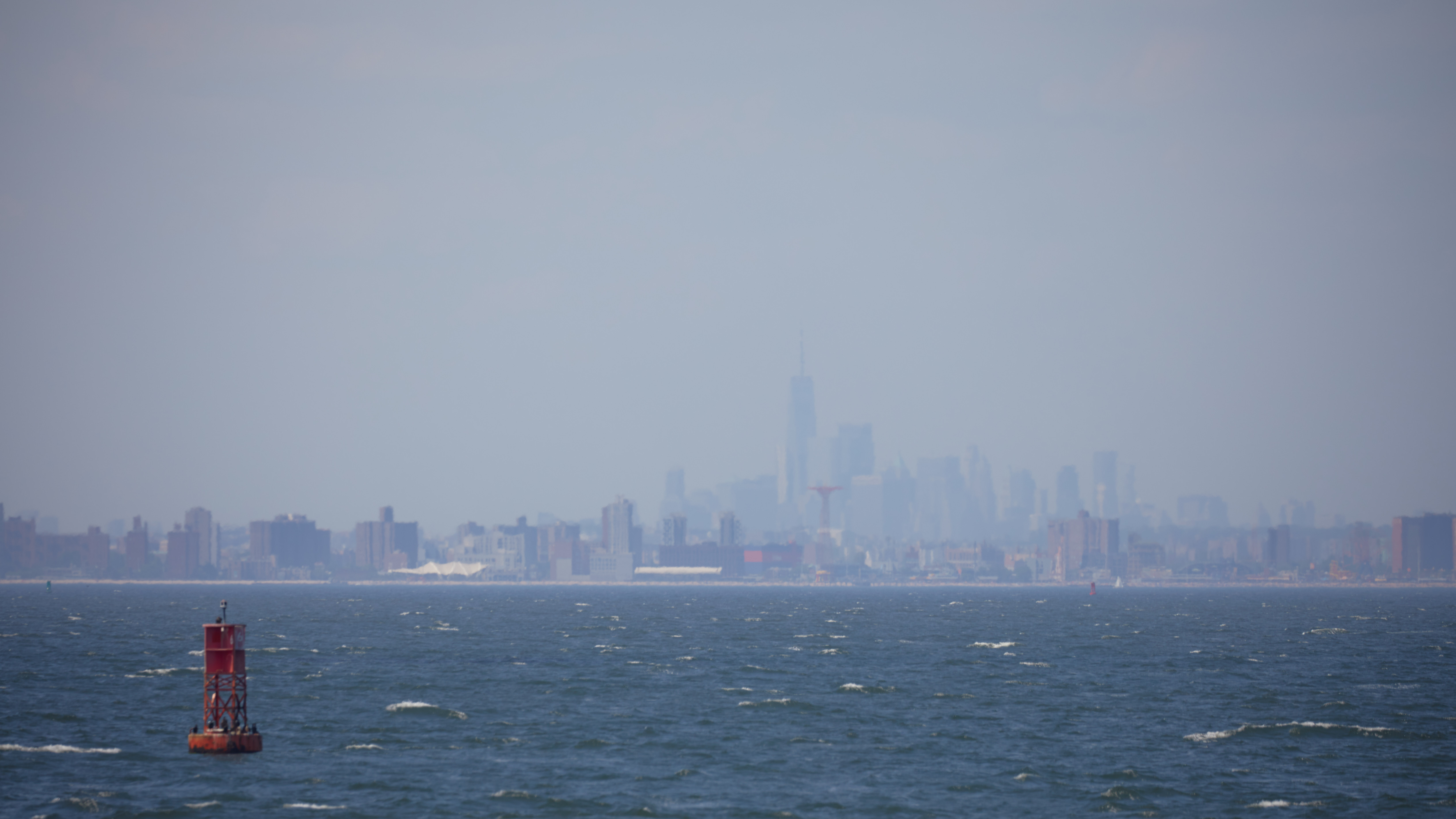 View of Manhattan skyline covered in haze.