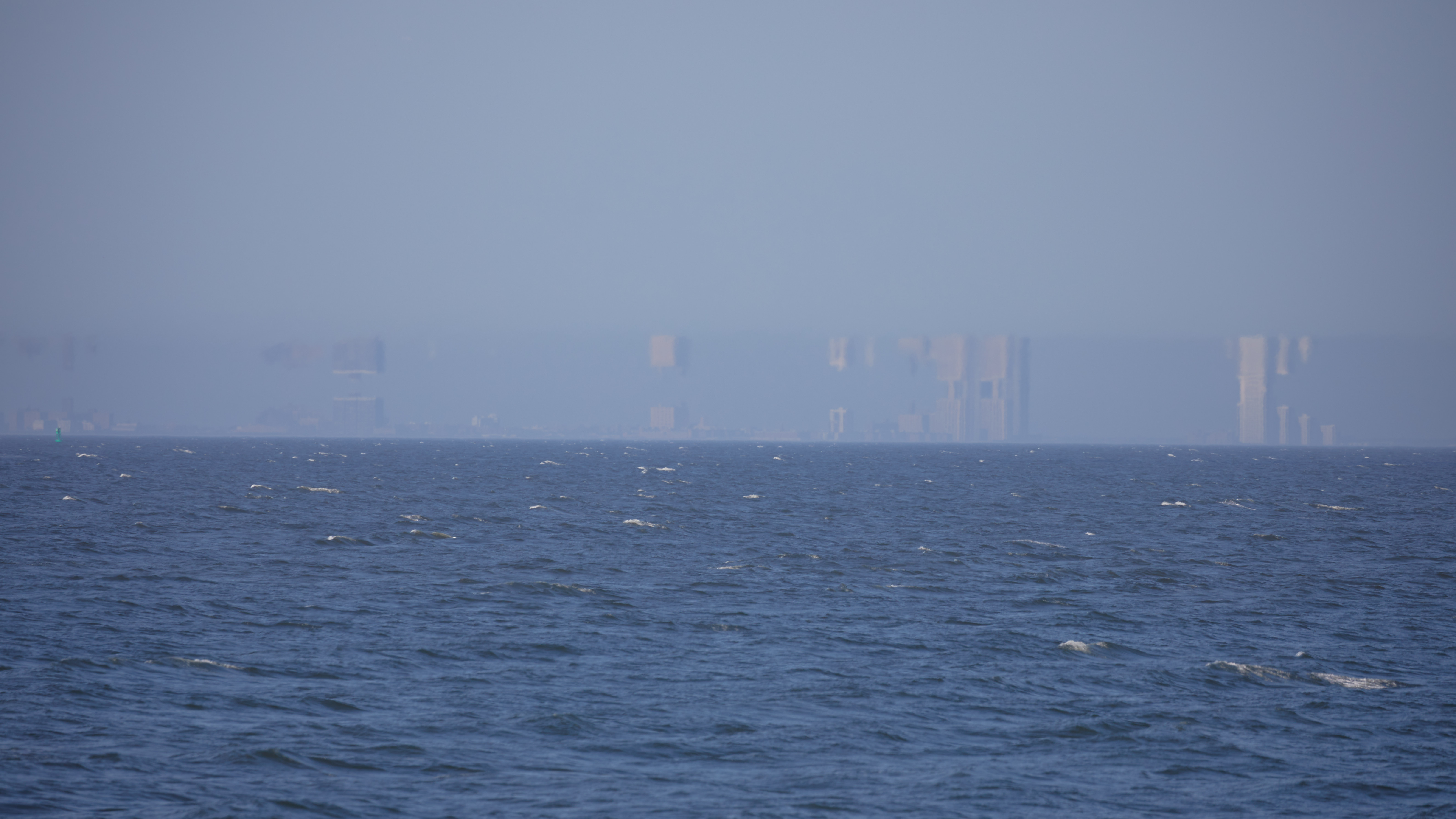 Fata Morgana effect of reflections of buildings in the sky.