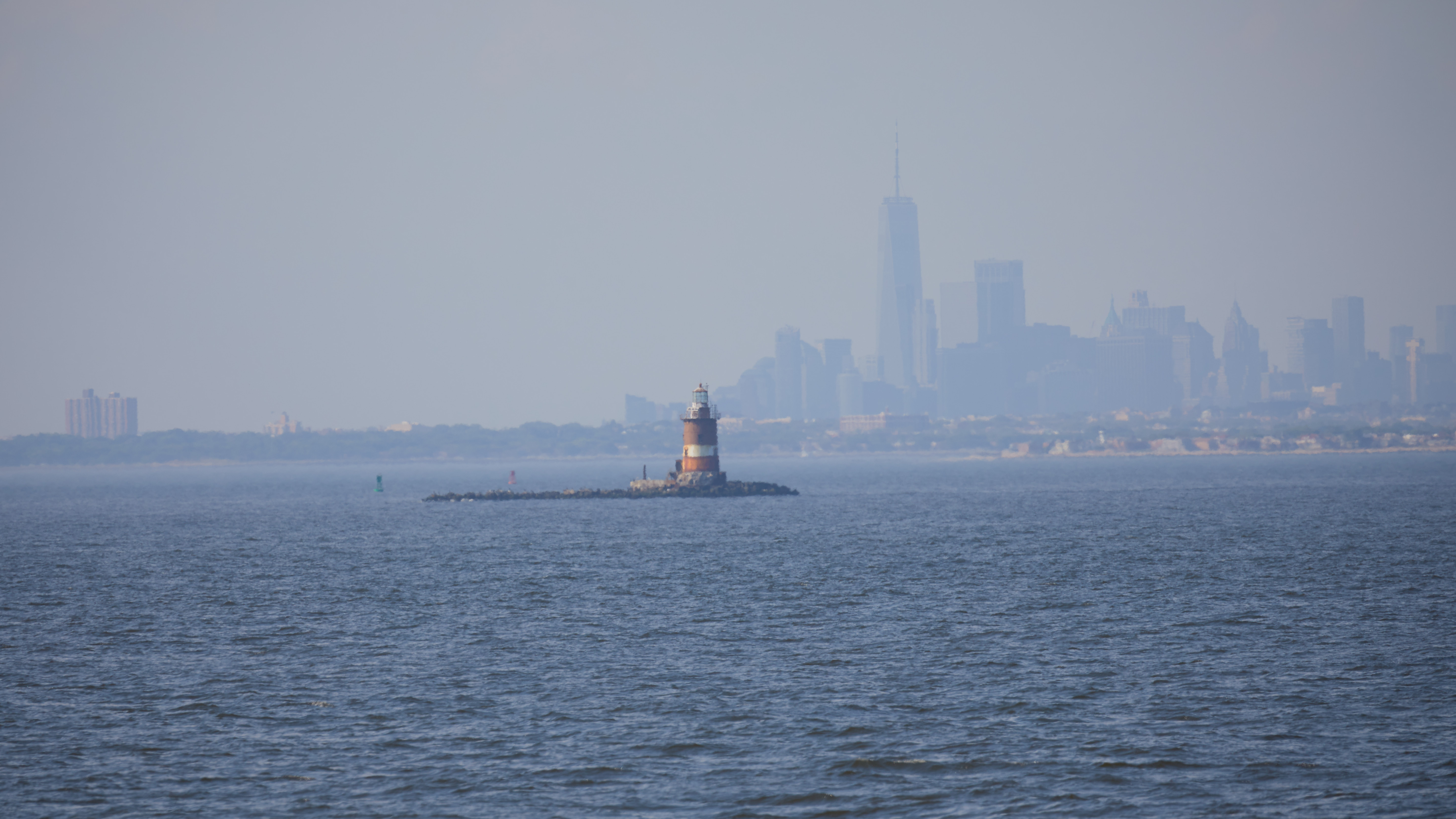 Romer Shoals lighthouse, with Manhattan skyline in distance.