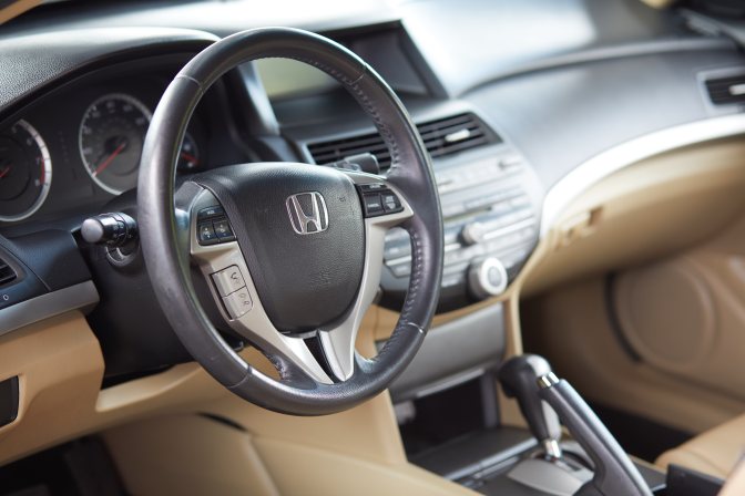 Interior of 2012 Honda Accord, including steering wheel and dashboard.