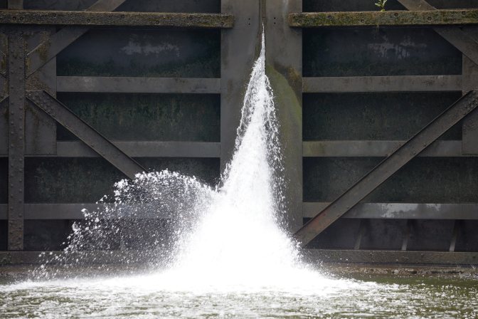 Leaking water coming through canal gates.