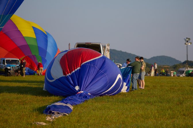 Blue Balloon beginning to inflate on ground.