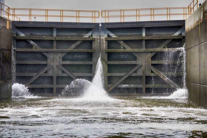 Lock doors, with water streaming through them.
