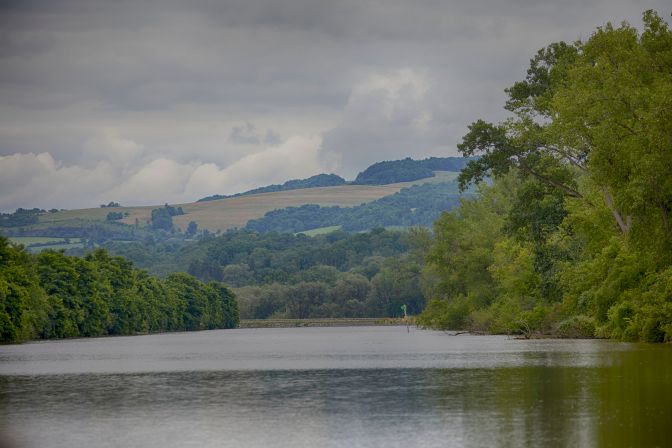 View of Erie Canal, with hills in distance.