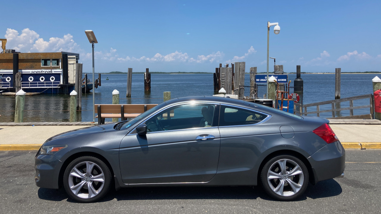 2012 Honda Accord coupe parked in front of ferry terminal.