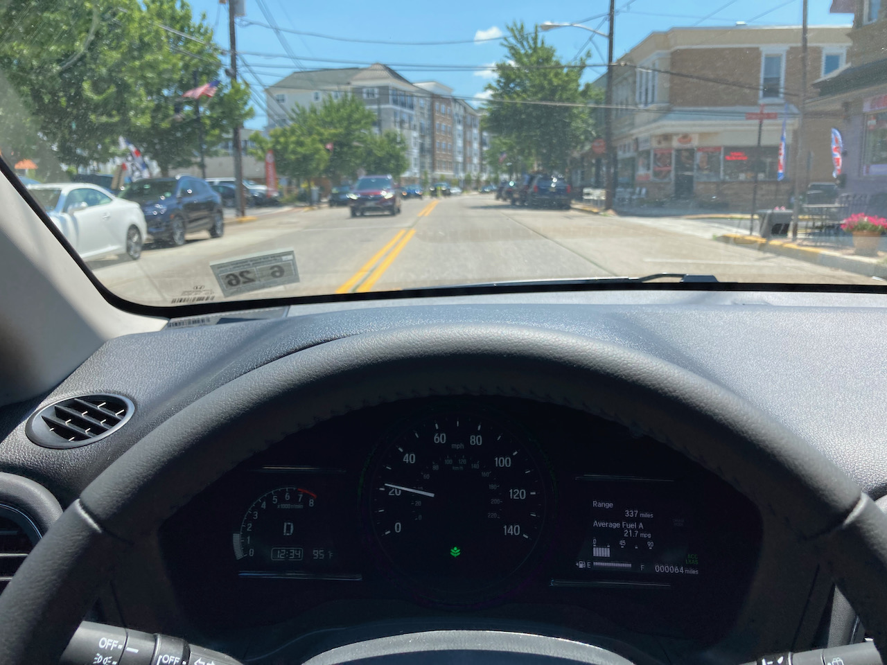 View of roadway, from behind wheel of Honda HR-V.